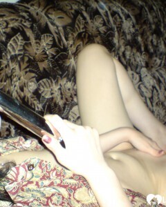 Smoking wife using a long metal dildo