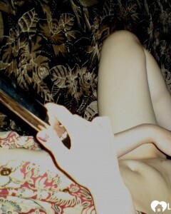 Smoking wife using a long metal dildo