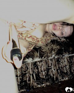 Smoking wife using a long metal dildo