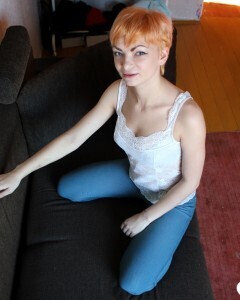 Smoking redhead takes a break from studying