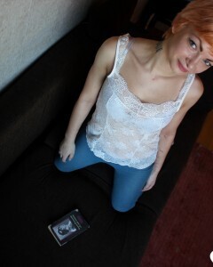 Smoking redhead takes a break from studying