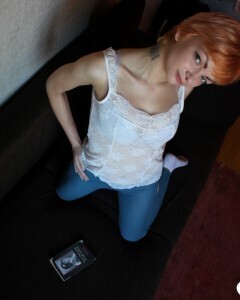 Smoking redhead takes a break from studying