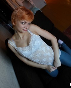 Smoking redhead takes a break from studying