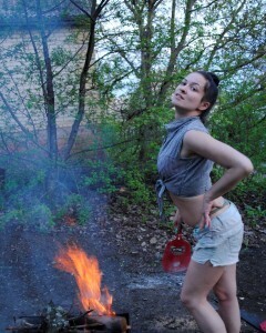 Barbecuing makes her hot so she strips