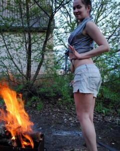 Barbecuing makes her hot so she strips