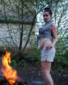 Barbecuing makes her hot so she strips