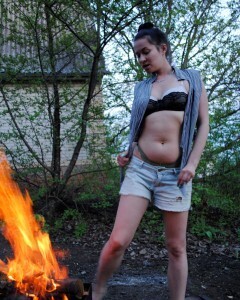Barbecuing makes her hot so she strips