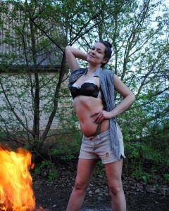 Barbecuing makes her hot so she strips