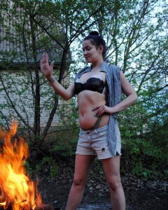 Barbecuing makes her hot so she strips