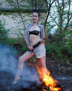 Barbecuing makes her hot so she strips