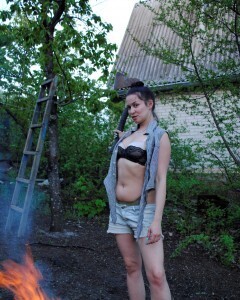 Barbecuing makes her hot so she strips