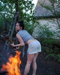 Barbecuing makes her hot so she strips