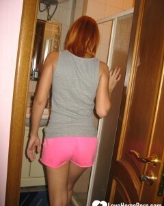 Redhead taking some hot selfies before showering