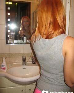 Redhead taking some hot selfies before showering