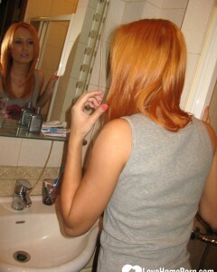 Redhead taking some hot selfies before showering