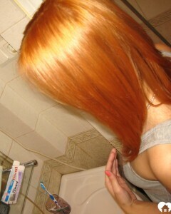 Redhead taking some hot selfies before showering
