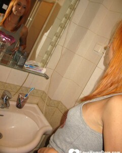 Redhead taking some hot selfies before showering
