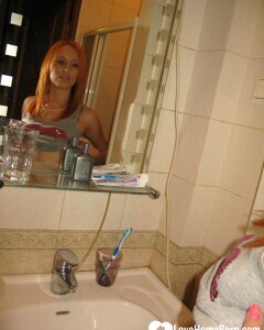Redhead taking some hot selfies before showering