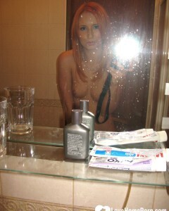 Redhead taking some hot selfies before showering