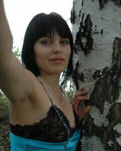 Lusty mom in lingerie posing in the woods