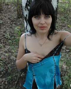 Lusty mom in lingerie posing in the woods