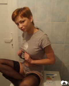 Babe in stockings taking selfies in the bathroom