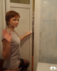 Babe in stockings taking selfies in the bathroom