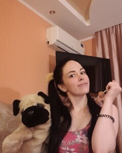 Brunette with pigtails poses in knee socks