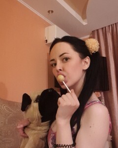 Brunette with pigtails poses in knee socks