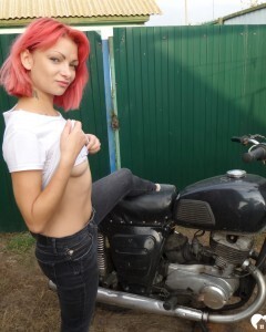 Redhead babe really likes my new bike