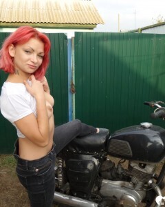 Redhead babe really likes my new bike