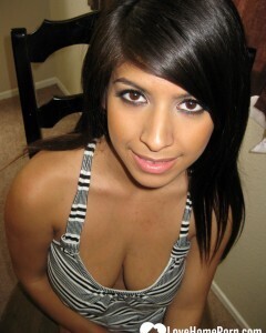 Busty cutie spreads her pussy lips wide