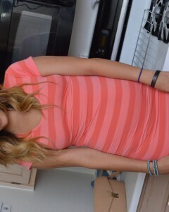 Attractive brunette lifts up her cute dress