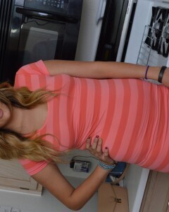 Attractive brunette lifts up her cute dress