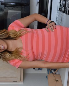 Attractive brunette lifts up her cute dress