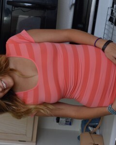 Attractive brunette lifts up her cute dress