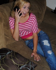 Blonde hottie strips before rubbing her pussy.