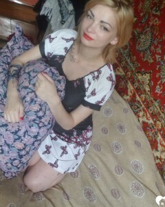 Luscious beauty with an ass tattoo fooling around