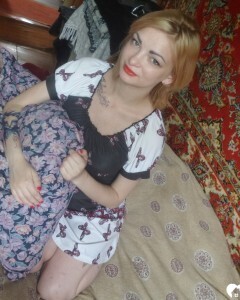 Luscious beauty with an ass tattoo fooling around