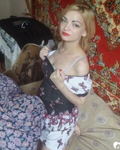 Luscious beauty with an ass tattoo fooling around