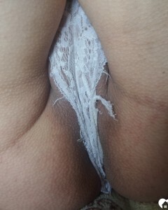 Luscious beauty with an ass tattoo fooling around