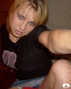 Blonde posing naked by the CTR monitor