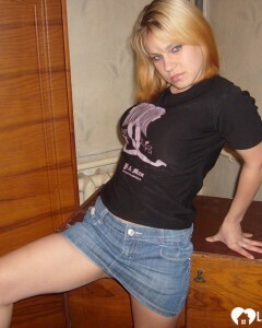 Blonde posing naked by the CTR monitor