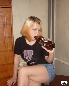 Blonde posing naked by the CTR monitor