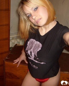 Blonde posing naked by the CTR monitor