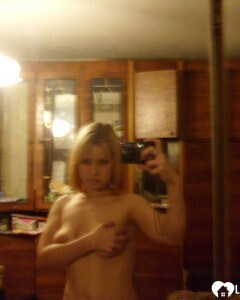 Blonde posing naked by the CTR monitor