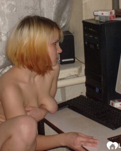 Blonde posing naked by the CTR monitor