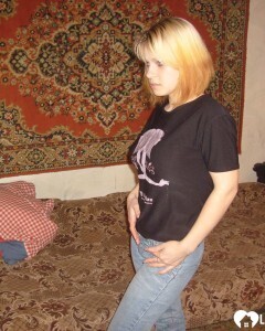 Blonde posing naked by the CTR monitor