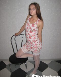 Brunette showing off her tattooed leg in stockings