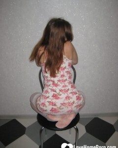 Brunette showing off her tattooed leg in stockings